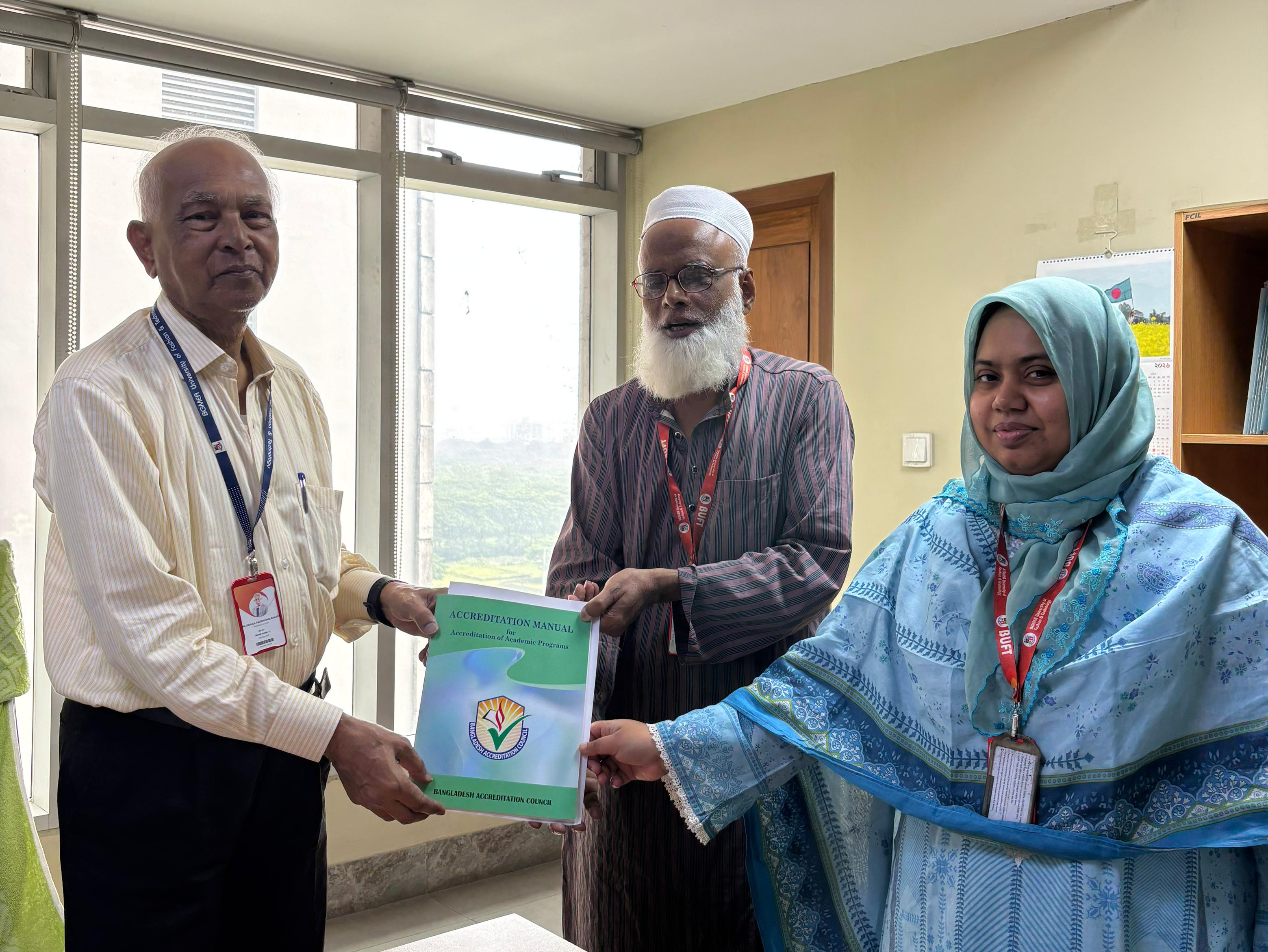 IQAC Directors Hands Over BAC Accreditation Manual to the Dean of Faculty of Engineering Studies (FES) for Accreditation Preparation.